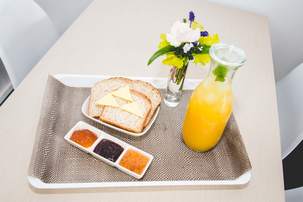 Bread with preserves and orange juice