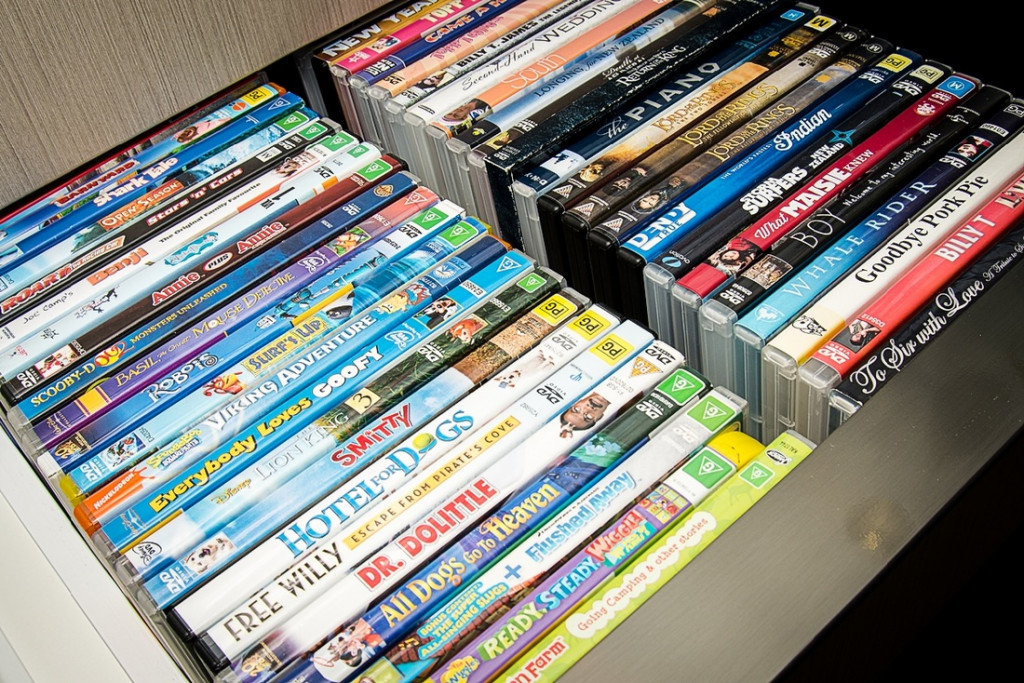 A stack of DVDs in a drawer